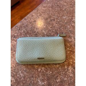 Woman’s mint green, leather, fossil wallet